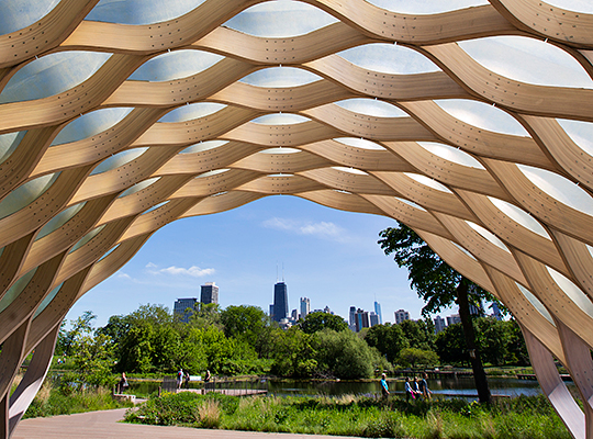 View of park and downtown through a sculpture at Lincoln Park