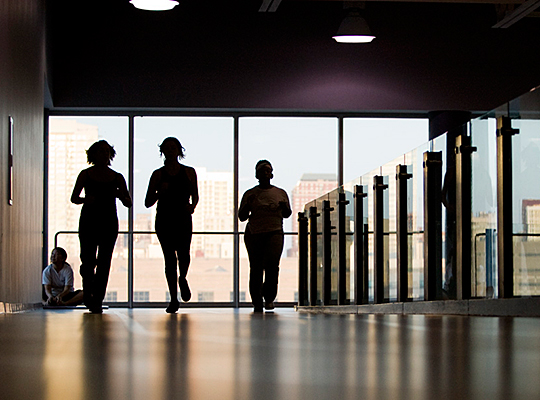 Silhouetted figures running