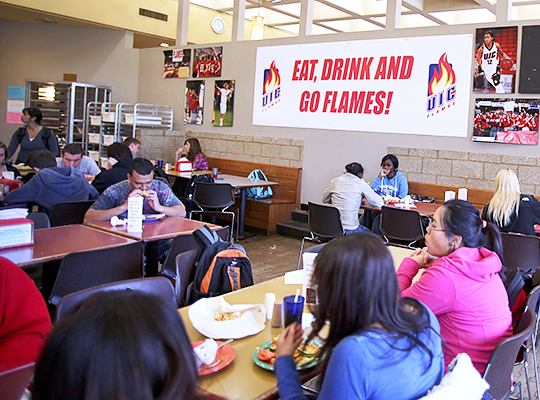 Students eating in a dining hall on east campus