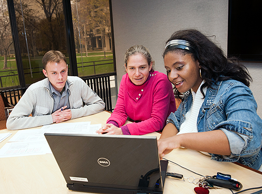 recious Walker and Randy Boley and Roberta Paikoff Holzmueller working at a computer