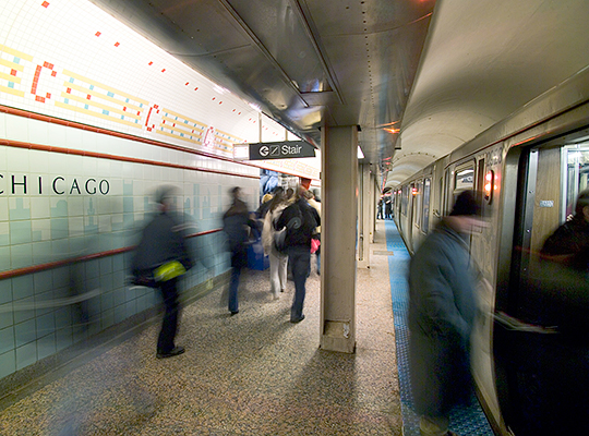 Time-lapse photo of passengers at the Chicago Red Line stop